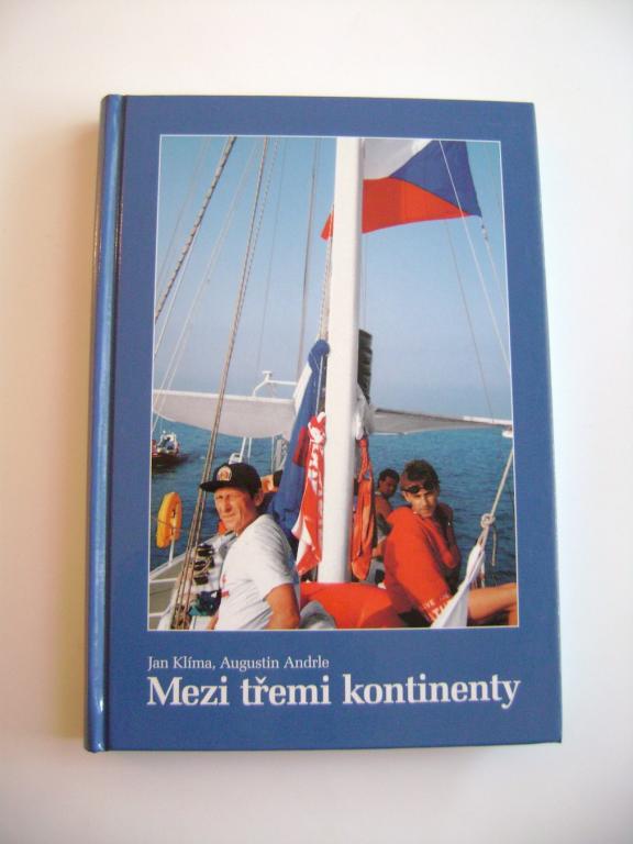 Jan KlÃ­ma, Augustin Andrle: MEZI TÅEMI KONTINENTY (2004, podpis autora) (A)